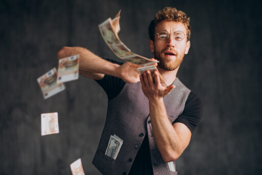 Man with banknotes isolated in studio
Деньги