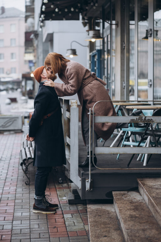 Adult loving couple kissing for the camera on the street.
друзья