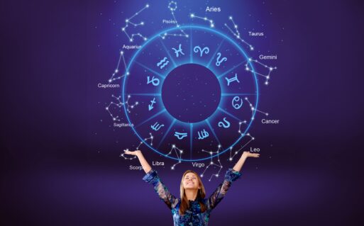 Woman raising hands looking at the night sky. Astrological wheel projection.
Гороскоп